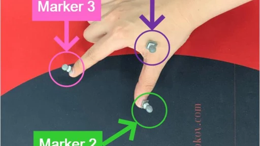 motion capture markers pasted on fingers